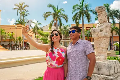 Couple selfie at Maya ruin replicas